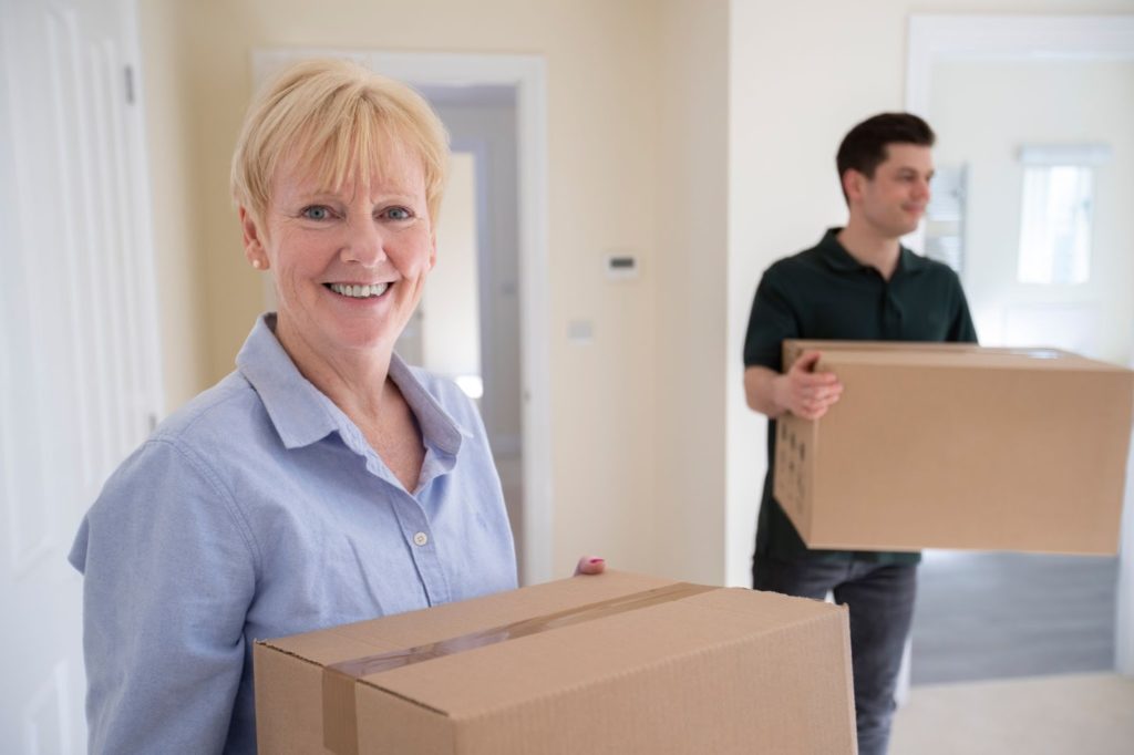 adult couple with moving boxes